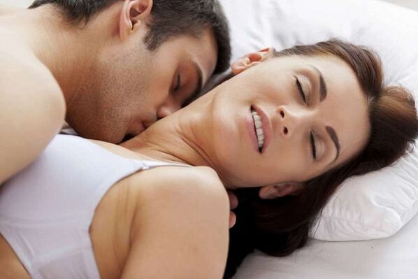 Tense man and woman in bed